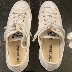 Converse women’s size 8 white with rose gold accents.